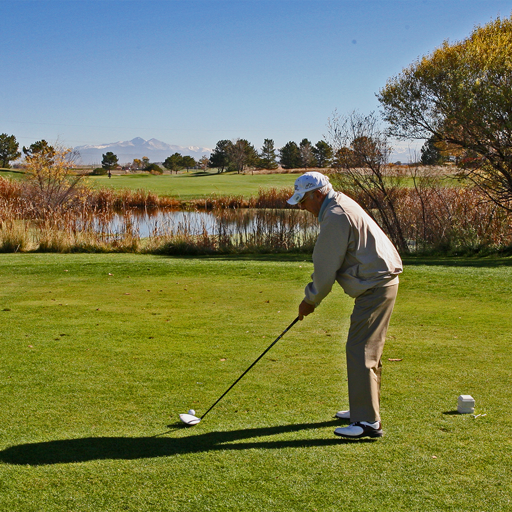 Fall golfing in Greeley Colorado with mountains in the background